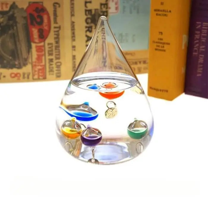 Thermomètre Galileo en verre, un design avec des sphères multicolores dans  un cadre en bois fini cerise